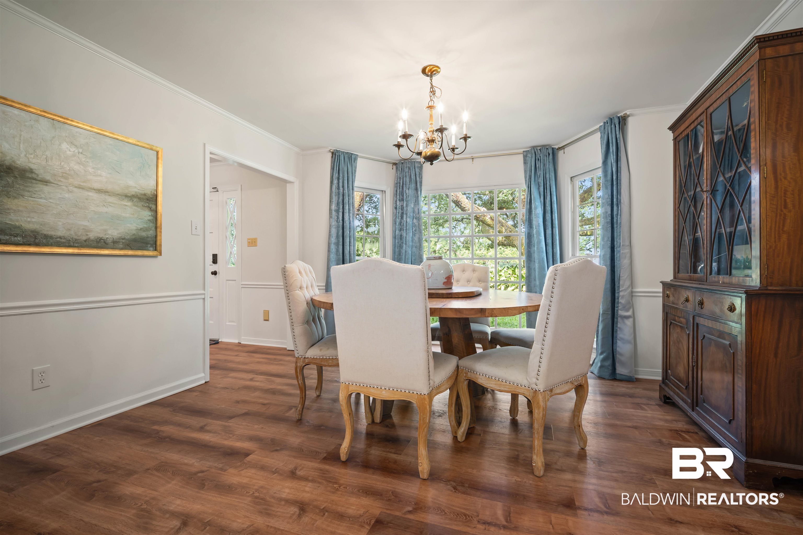 700 Eliza Jordan Road North Mobile, AL 36608 - Photo 14 of 44 Dining space featuring a chandelier, dark wood-style flooring, and ornamental molding