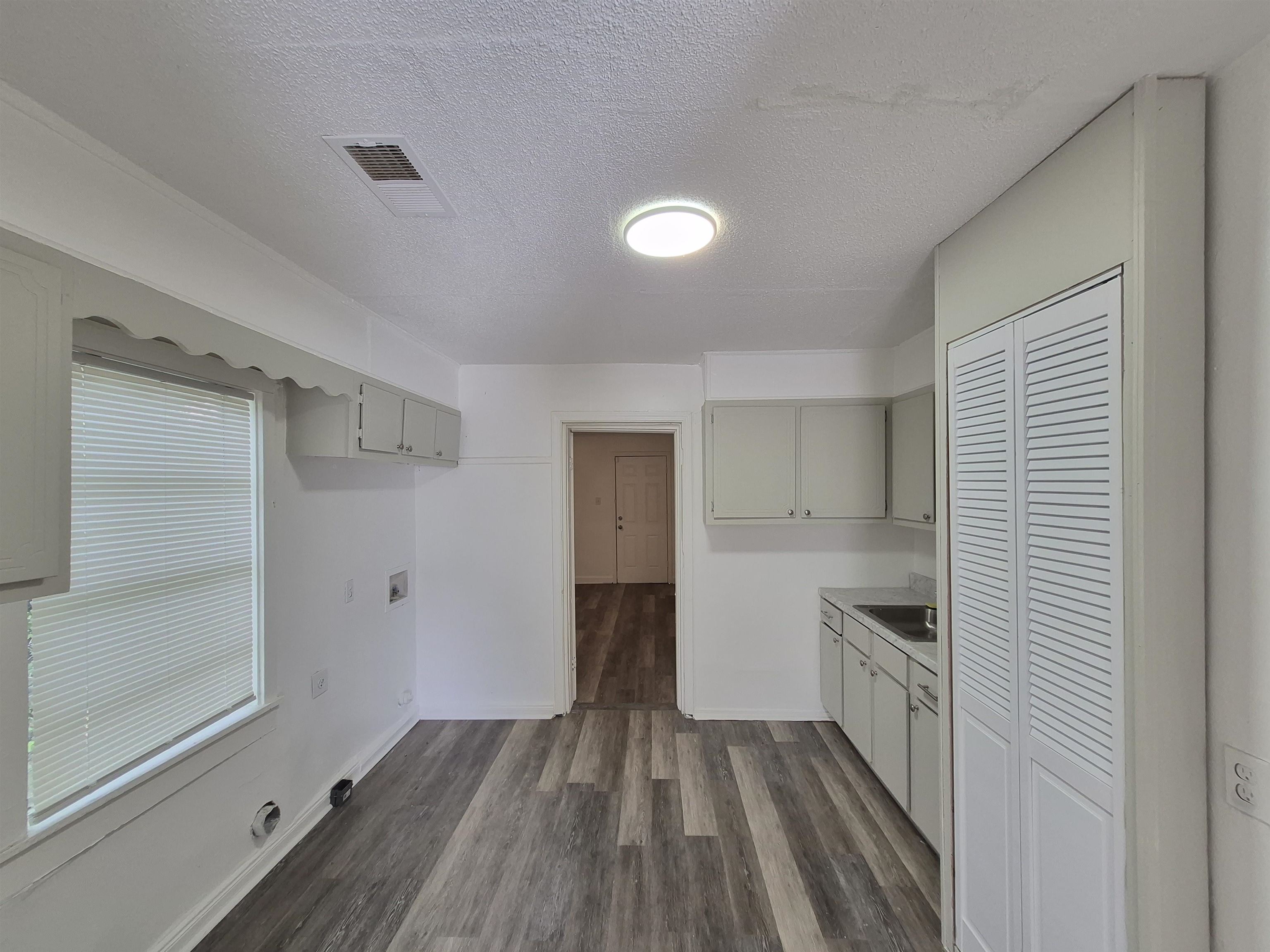 2100 Riverside Boulevard Memphis, TN 38109 - Photo 3 of 10 a view of kitchen with wooden floor