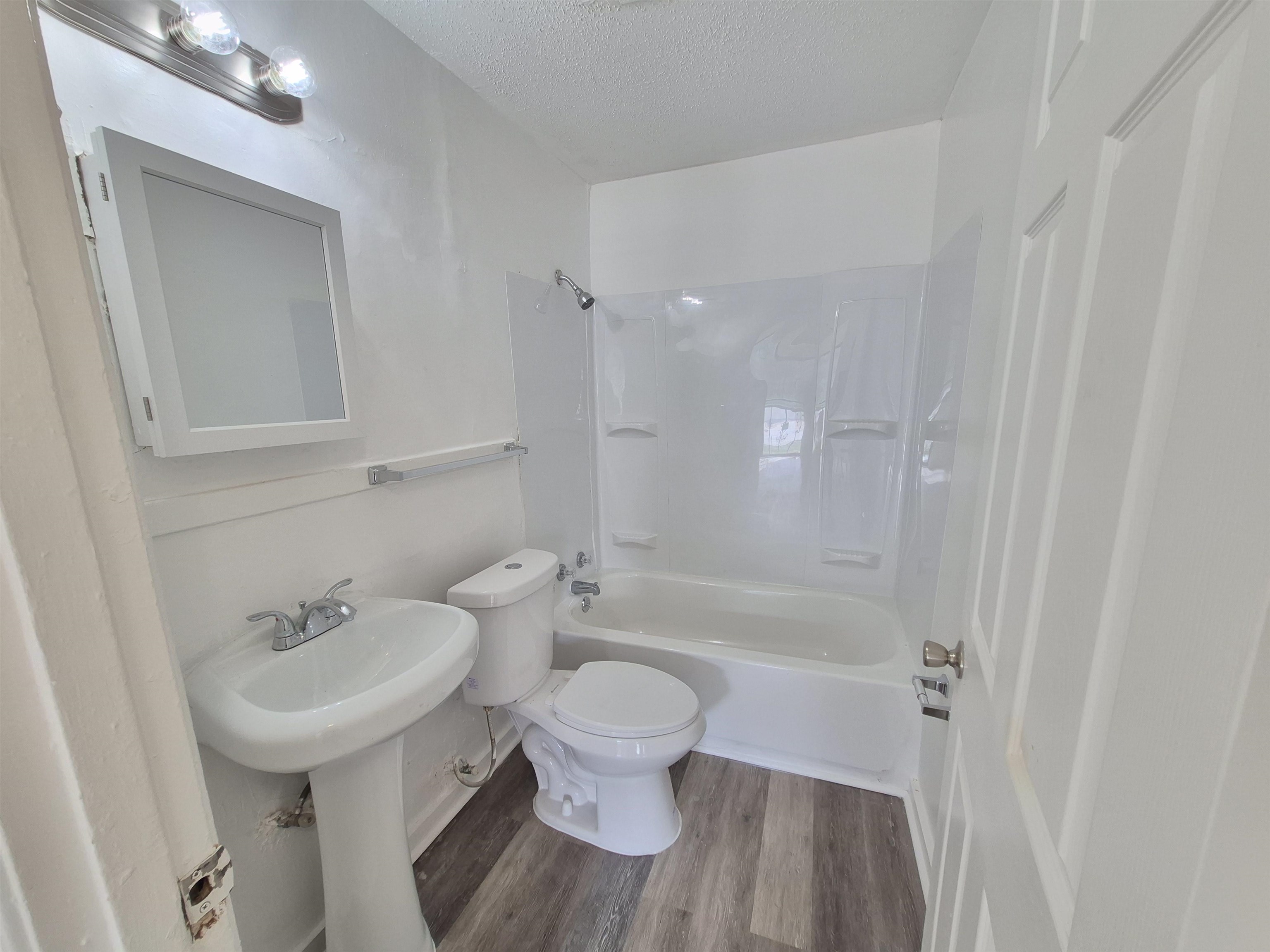 2100 Riverside Boulevard Memphis, TN 38109 - Photo 8 of 10 a bathroom with a sink a toilet and shower