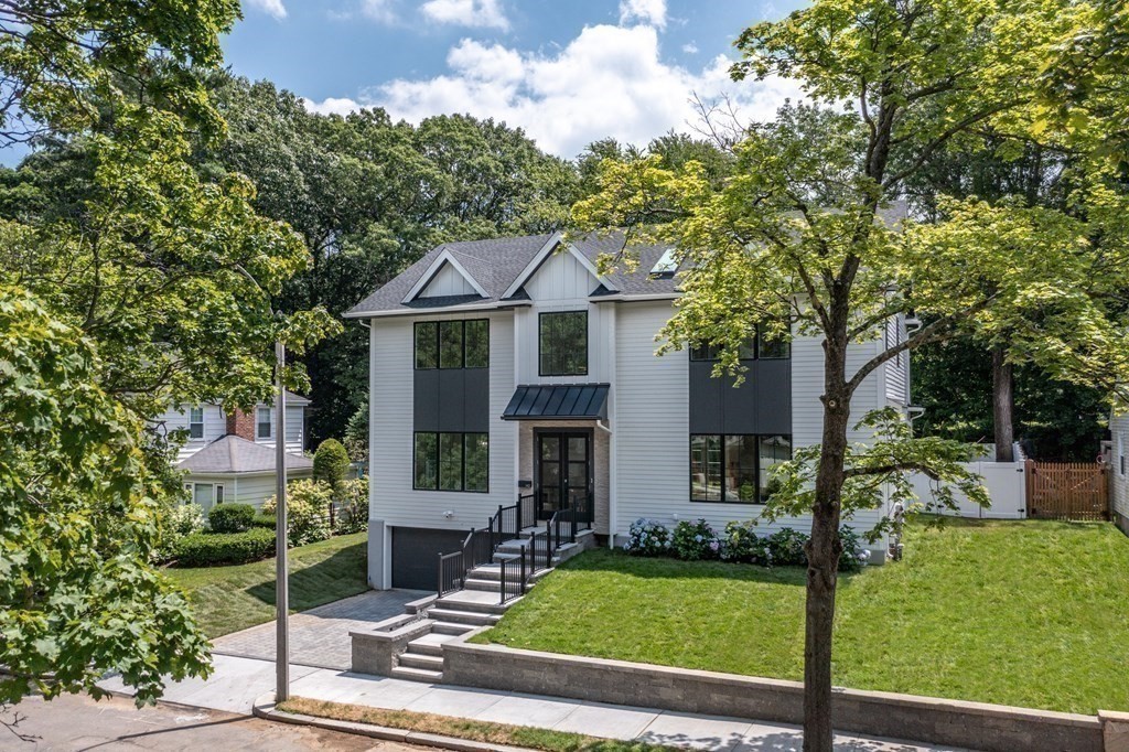 142 Bellingham Road Chestnut Hill, MA 02467 - Photo 31 of 37 a front view of a house with a yard