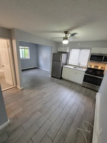 a bathroom with a sink a mirror and a bathtub
