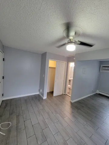 a white toilet sitting next to a bathroom sink