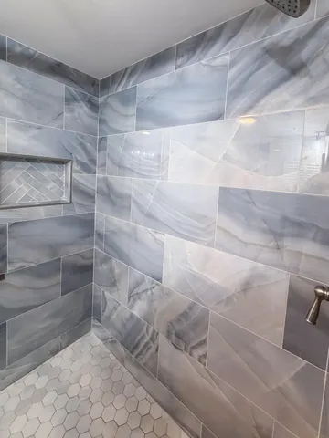 a view of a refrigerator in kitchen and wooden floor