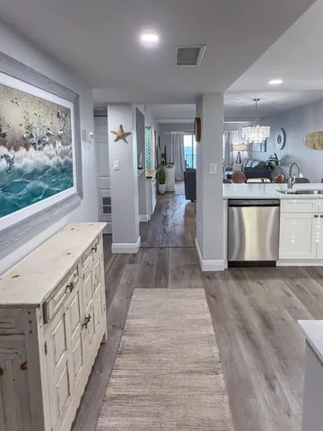 a kitchen with stainless steel appliances granite countertop a stove and a sink