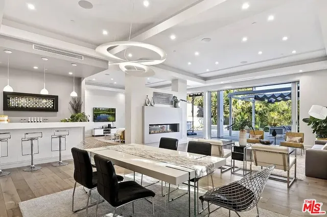 a large kitchen with a table and chairs