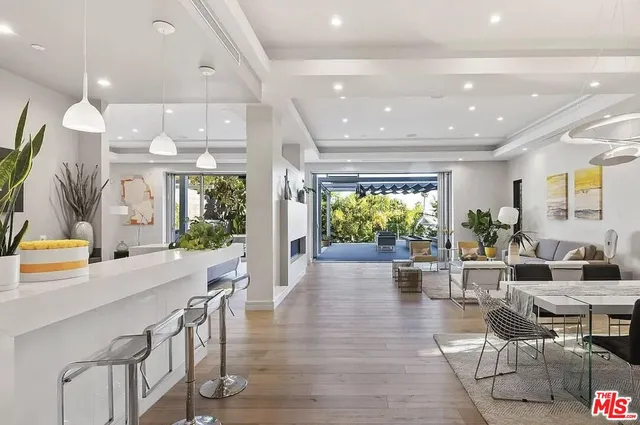 a lobby with furniture and floor to ceiling window