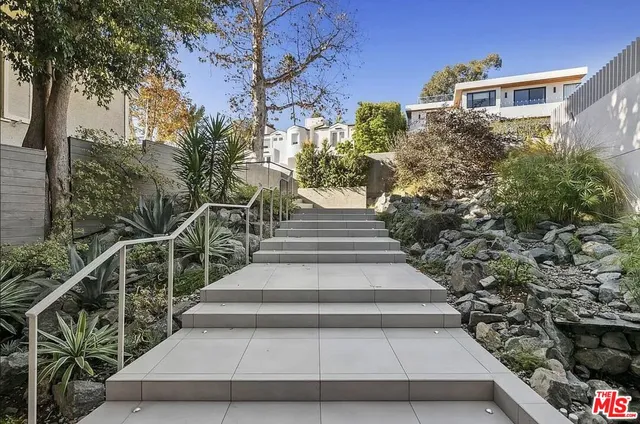 a view of entryway with flower plants