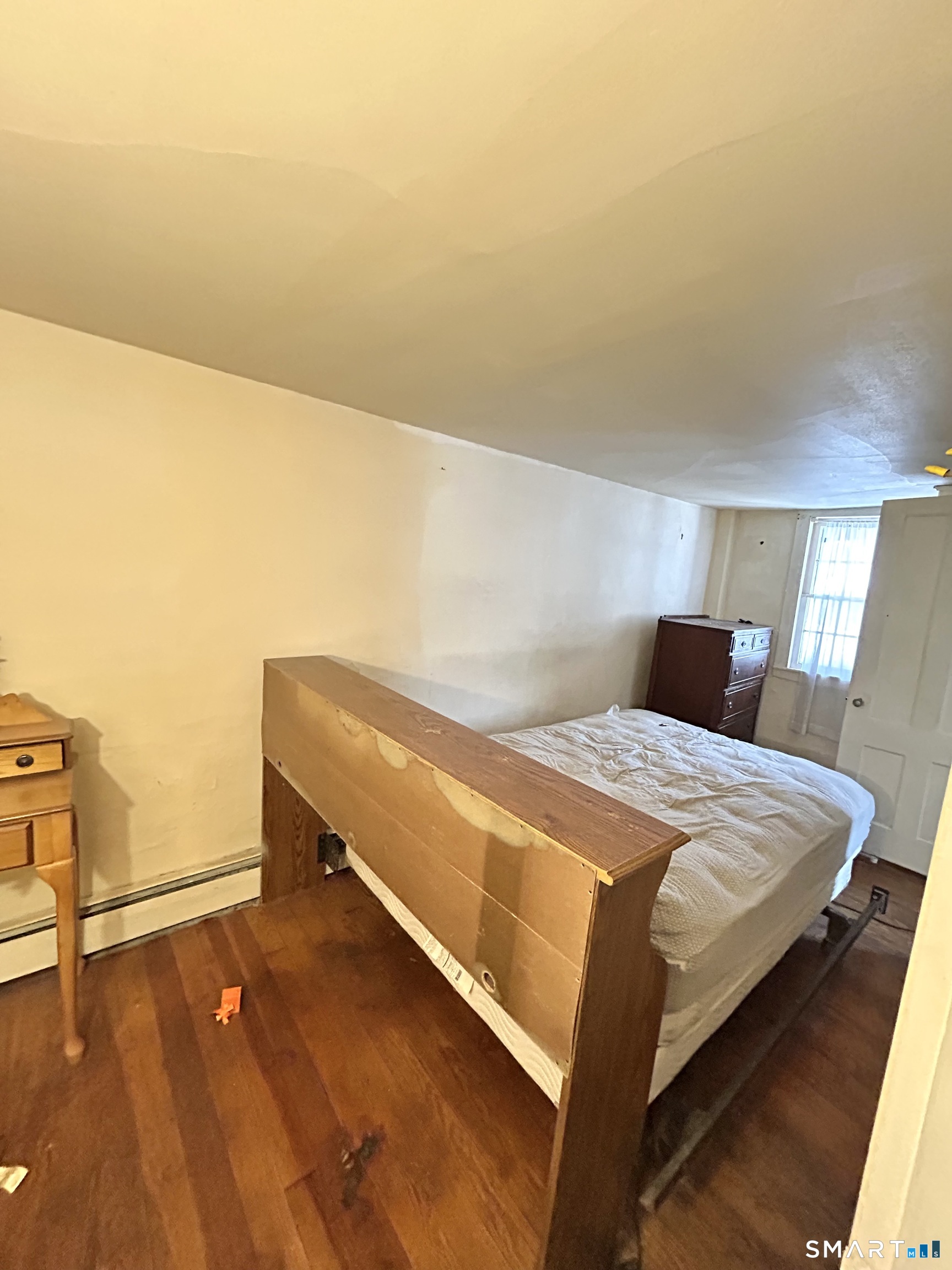 64 Bridge Street Canton, CT 06019 - Photo 11 of 12 a bedroom with a bed and cabinets