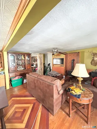 a living room with furniture and a lamp