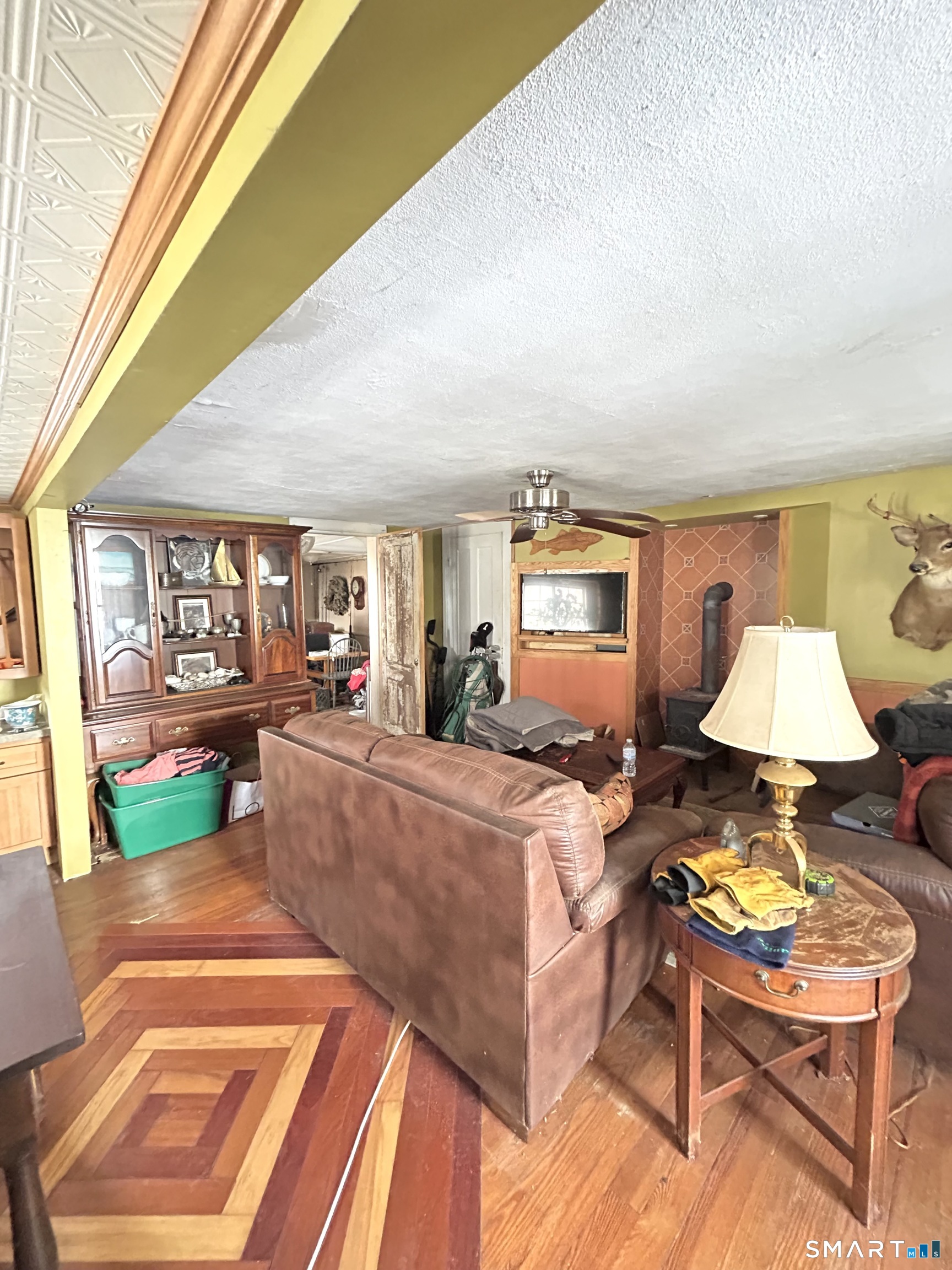 64 Bridge Street Canton, CT 06019 - Photo 4 of 12 a living room with furniture and a lamp