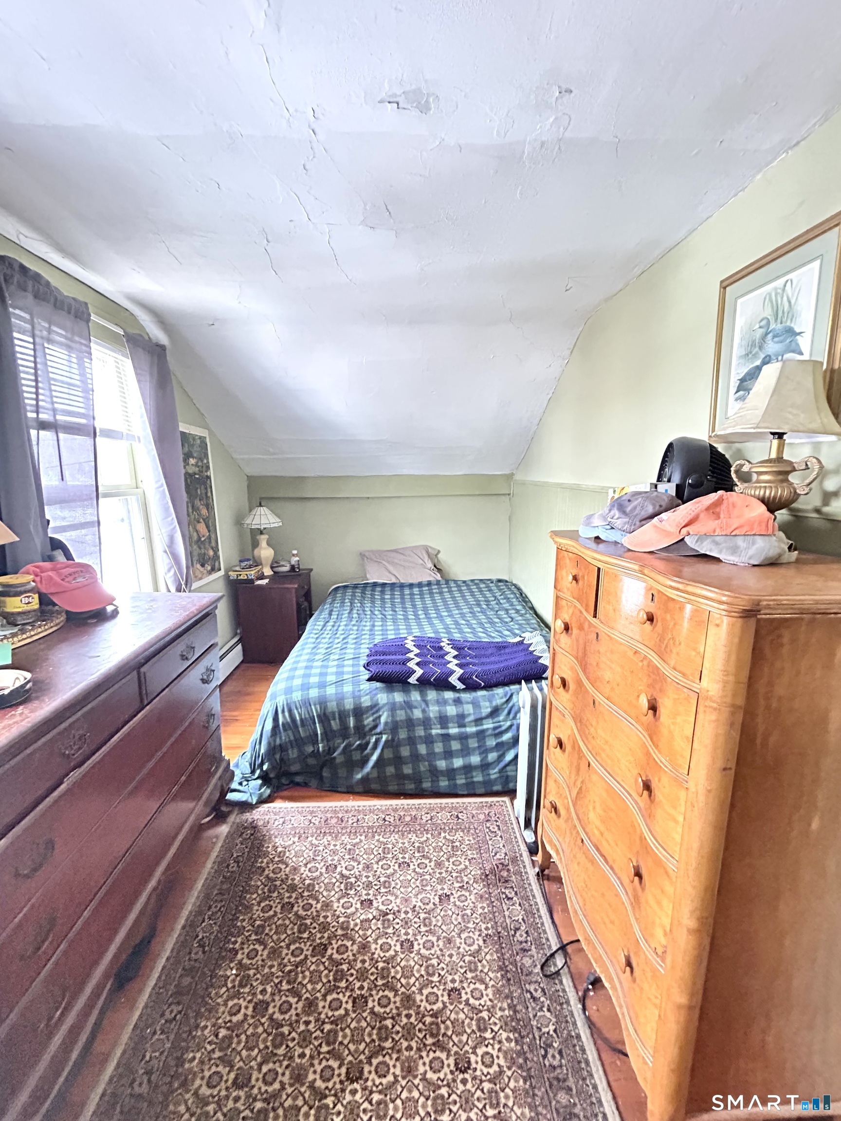 64 Bridge Street Canton, CT 06019 - Photo 7 of 12 a bedroom with a bed and a dresser