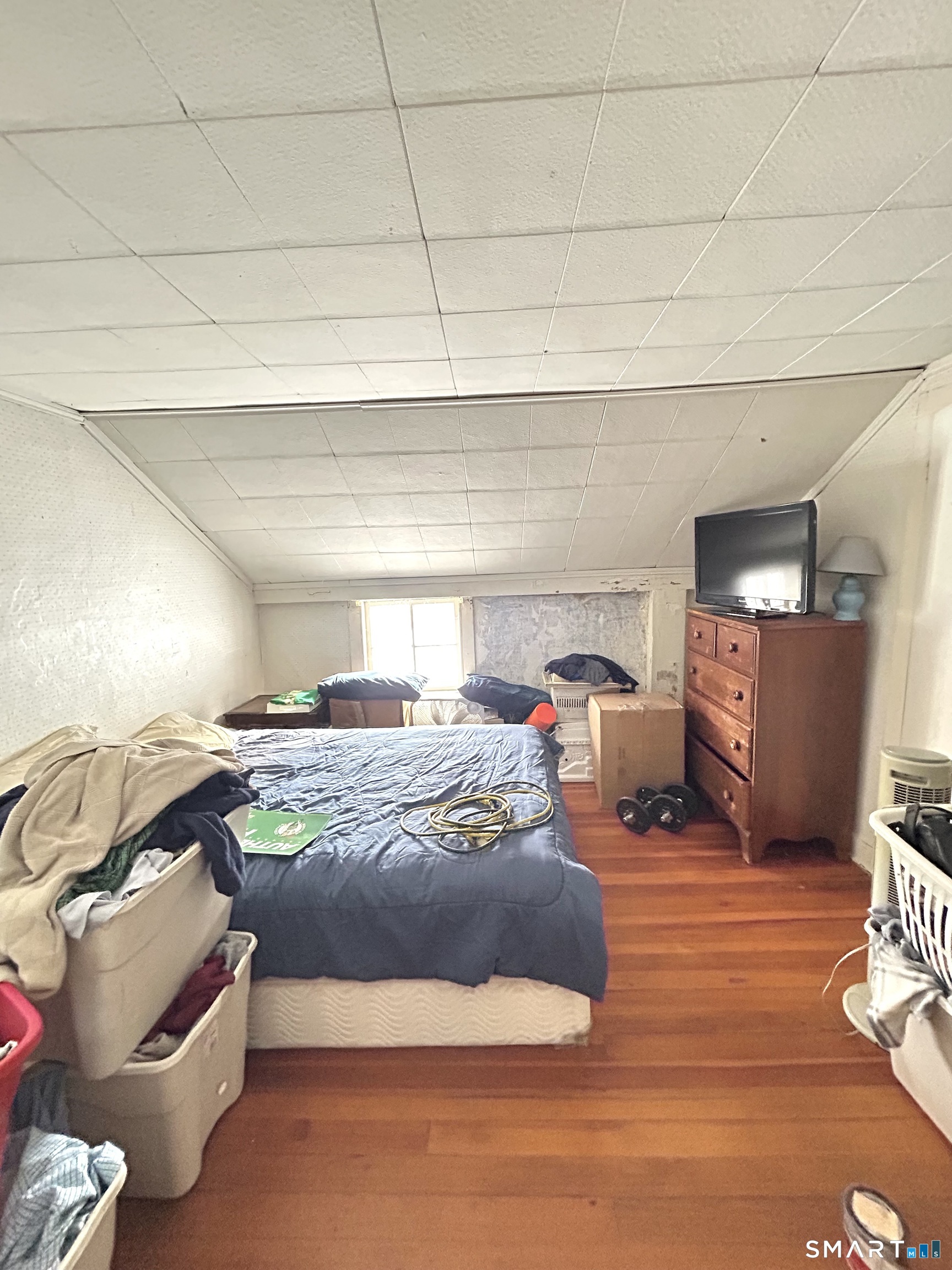 64 Bridge Street Canton, CT 06019 - Photo 8 of 12 a bed room with a bed and a chair