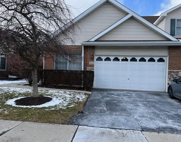 a view of a house with a sink and a yard
