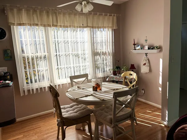 a dining room with furniture and window