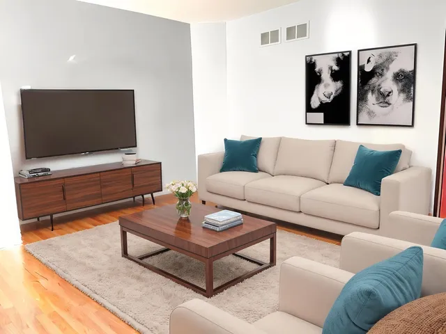a living room with furniture and a flat screen tv
