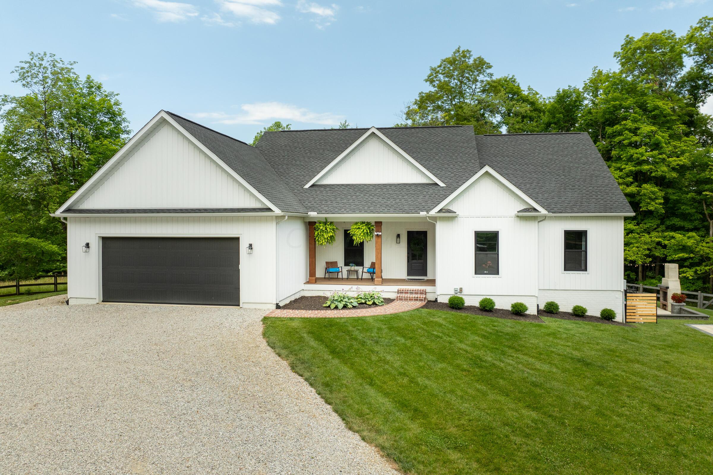 Front view of the home with attached 2-car garage and 4734 SqFt of exceptional living space.
