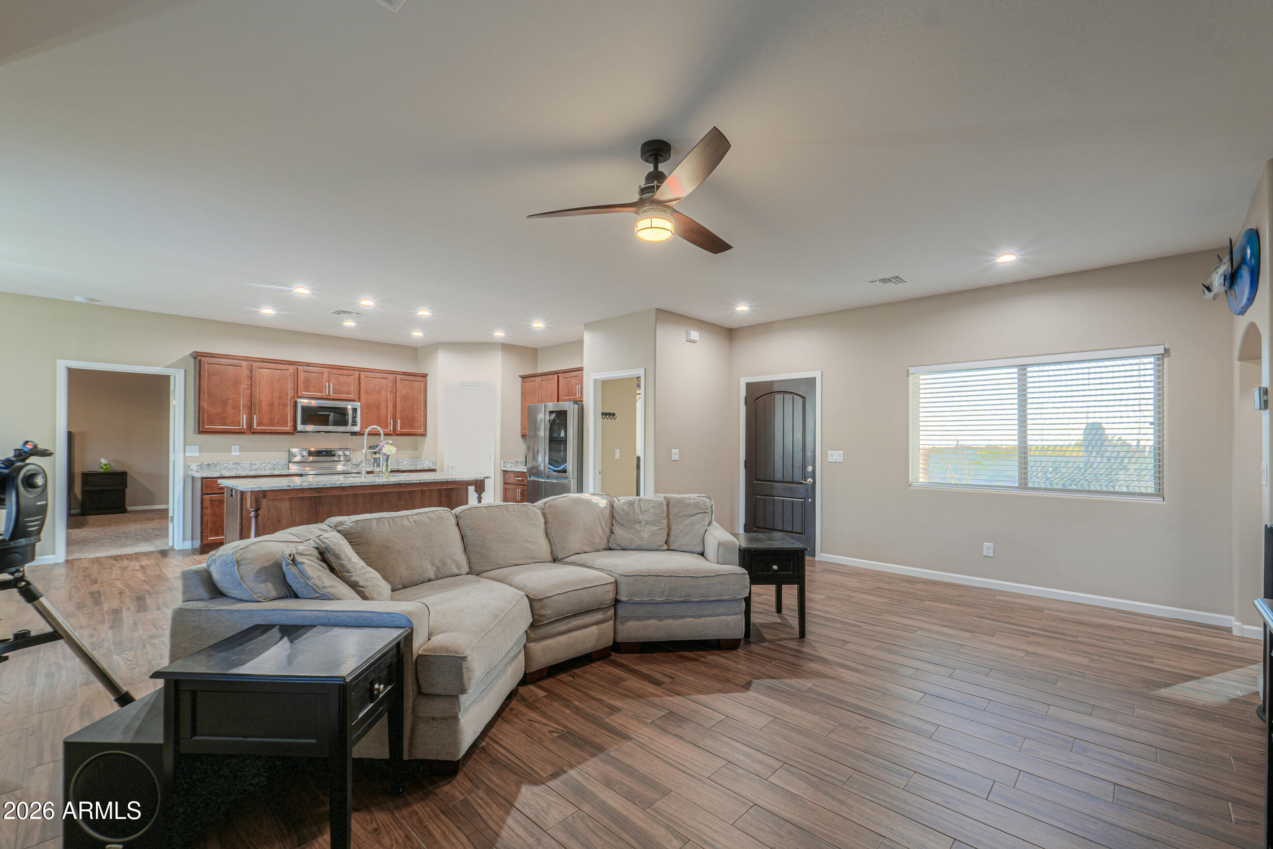 1487 South Mountain View Road Apache Junction, AZ 85119 - Photo 12 of 60 a living room with furniture and a ceiling fan