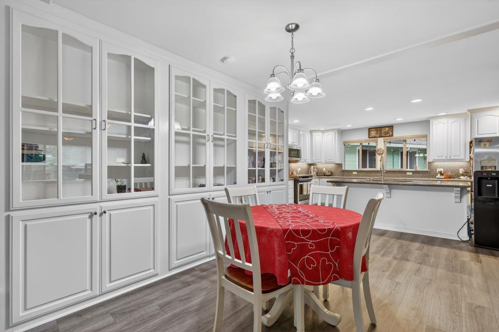 2026 Lily Valley Way West Point, CA 95255 - Photo 23 of 39 a view of a dining room with furniture window and wooden floor