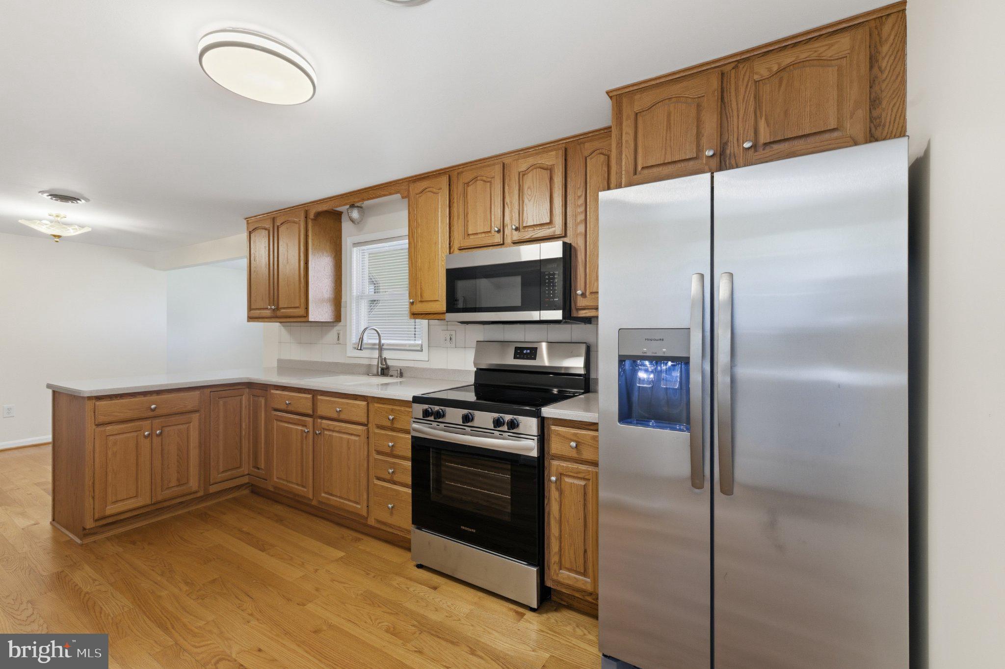 3624 Kemptown Church Road Monrovia, MD 21770 - Photo 31 of 68 Modern kitchen with warm wood tones.