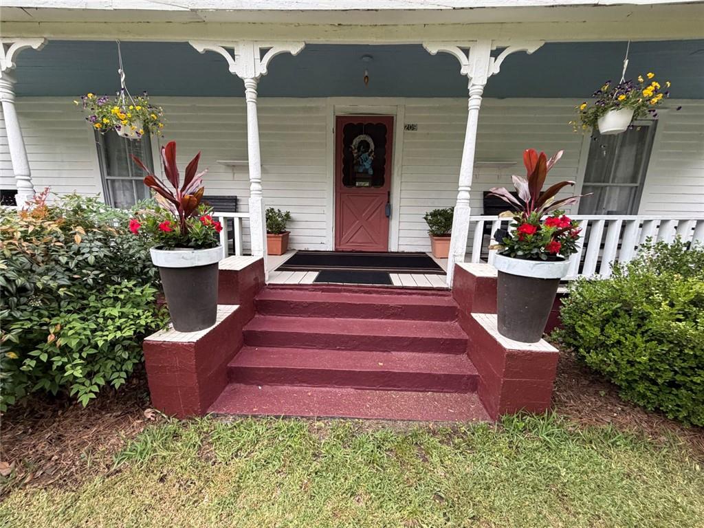 209 Old Perry Road Marshallville, GA 31057 - Photo 11 of 40 a front view of a house with entryway