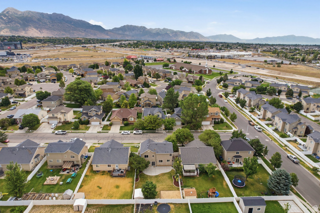 2223 North Pointe Meadow Loop Lehi, UT 84048 - Photo 54 of 56 Residential neighborhood with diverse home styles, paved streets, and mature landscaping