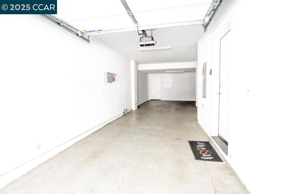 9877 MacArthur Boulevard, Unit E Oakland, CA 94605 - Photo 12 of 13 a view of a living room with a white walls