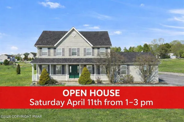 a view of a garden with an outdoor space and seating area