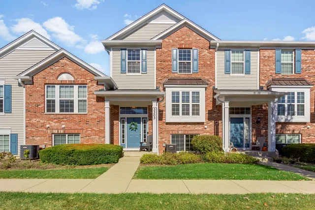 a front view of a house with a yard