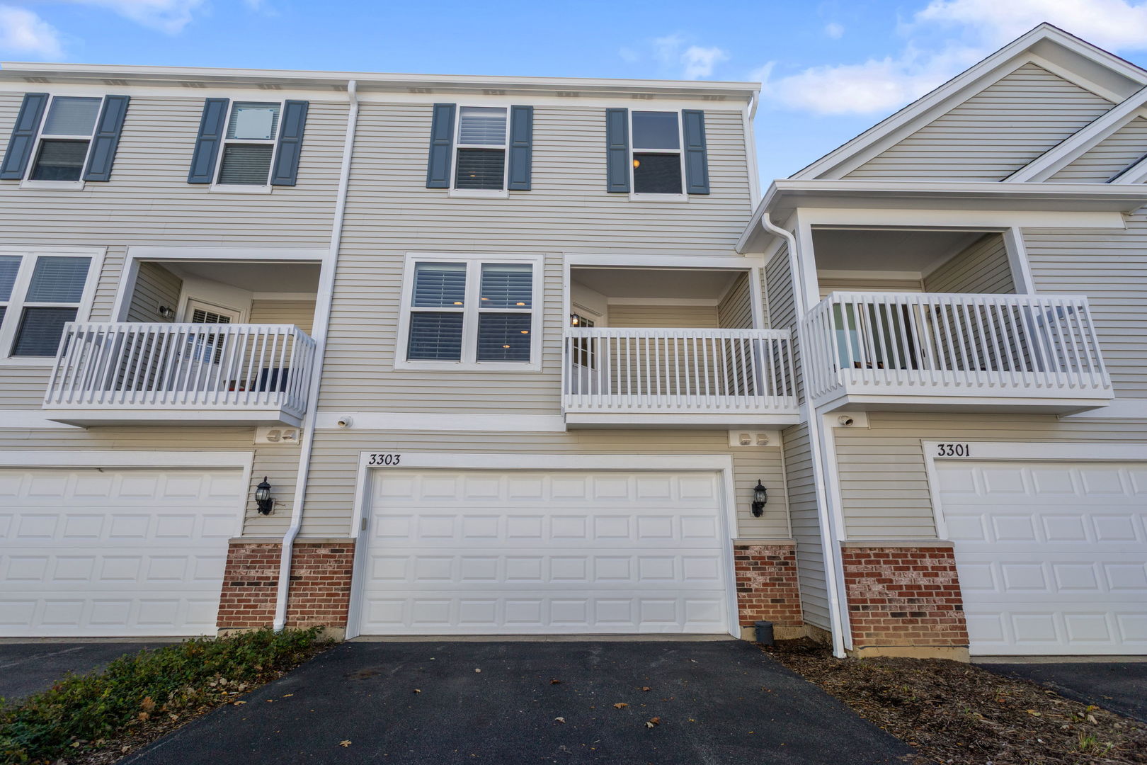 3303 Redbud Drive Lindenhurst, IL 60046 - Photo 17 of 25 a front view of a house with a parking area