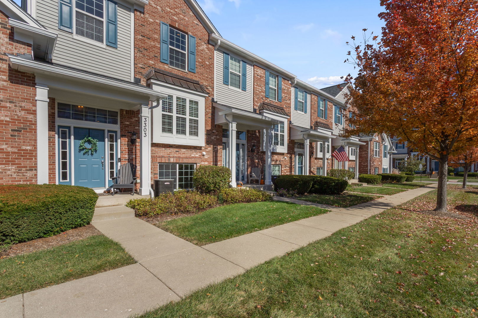 3303 Redbud Drive Lindenhurst, IL 60046 - Photo 2 of 25 a view of a brick building next to a yard