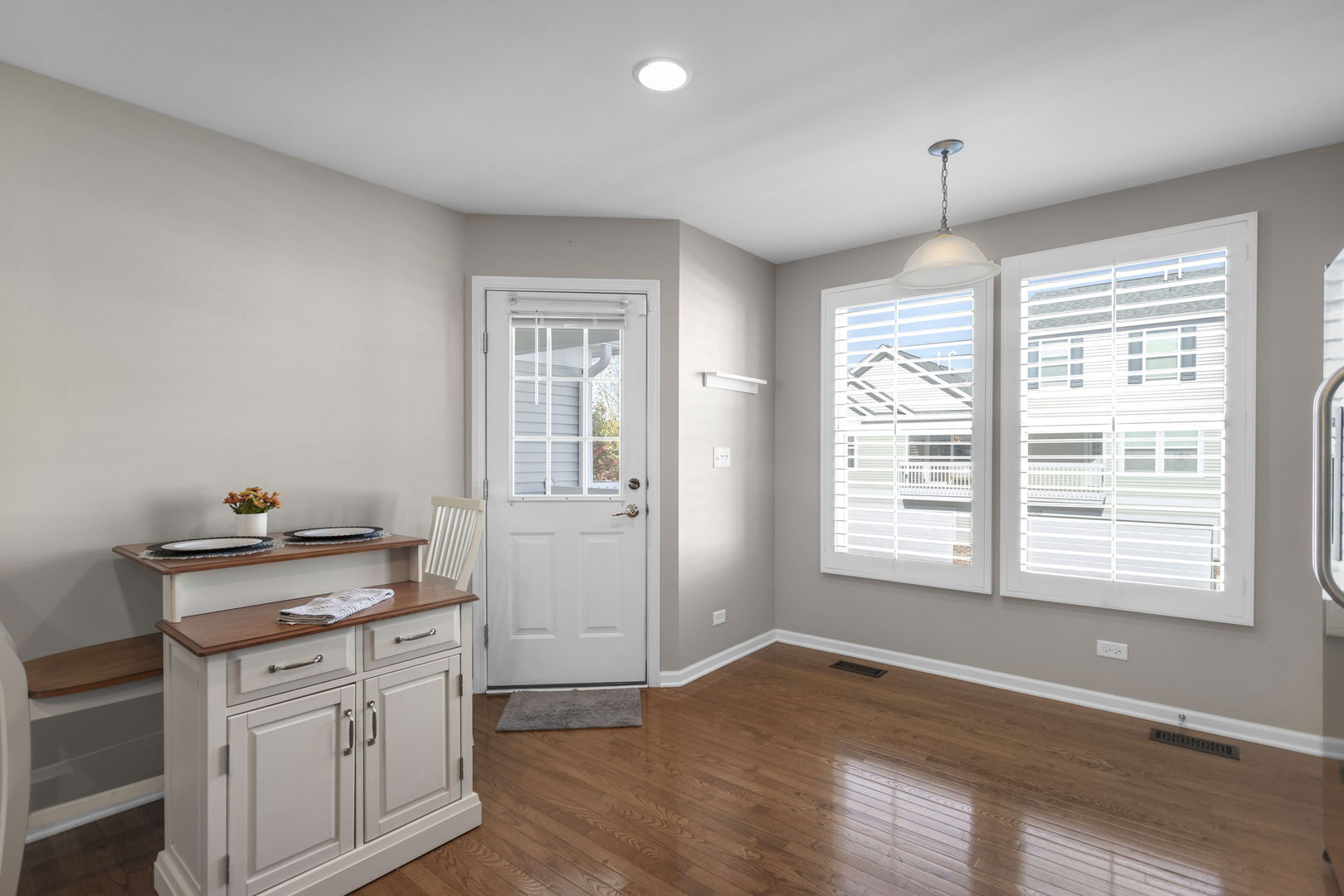 3303 Redbud Drive Lindenhurst, IL 60046 - Photo 6 of 25 a view of a kitchen with dishwasher and wooden floor