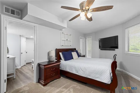a bedroom with bed and window