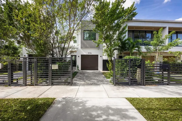 a front view of a house with a garage
