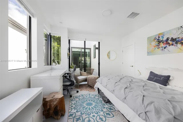 a bed room with a bed and a couch