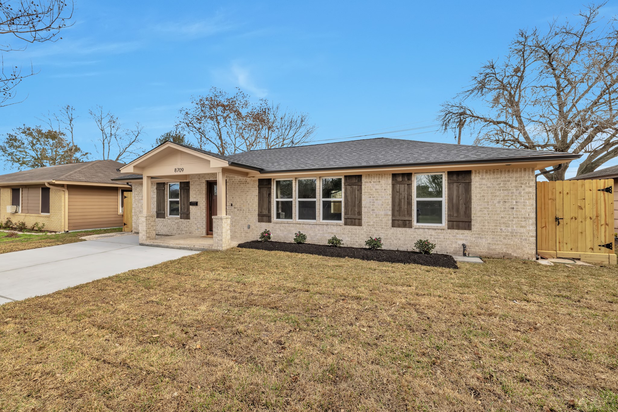 8709 Tarbell Road Houston, TX 77034 - Photo 1 of 25 a front view of a house with a garden