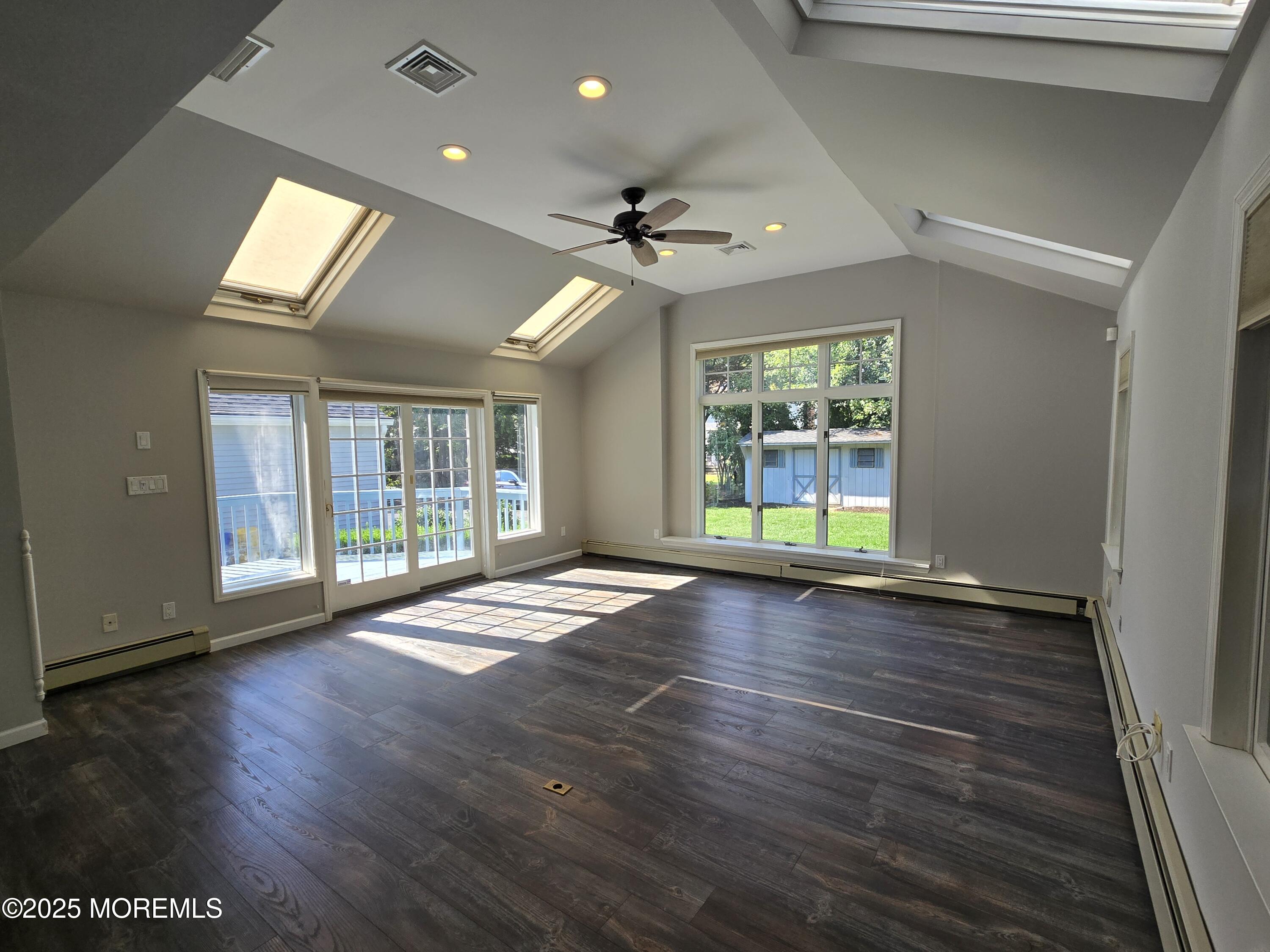 77 Dutch Lane Road Freehold, NJ 07728 - Photo 15 of 50 an empty room with wooden floor and windows