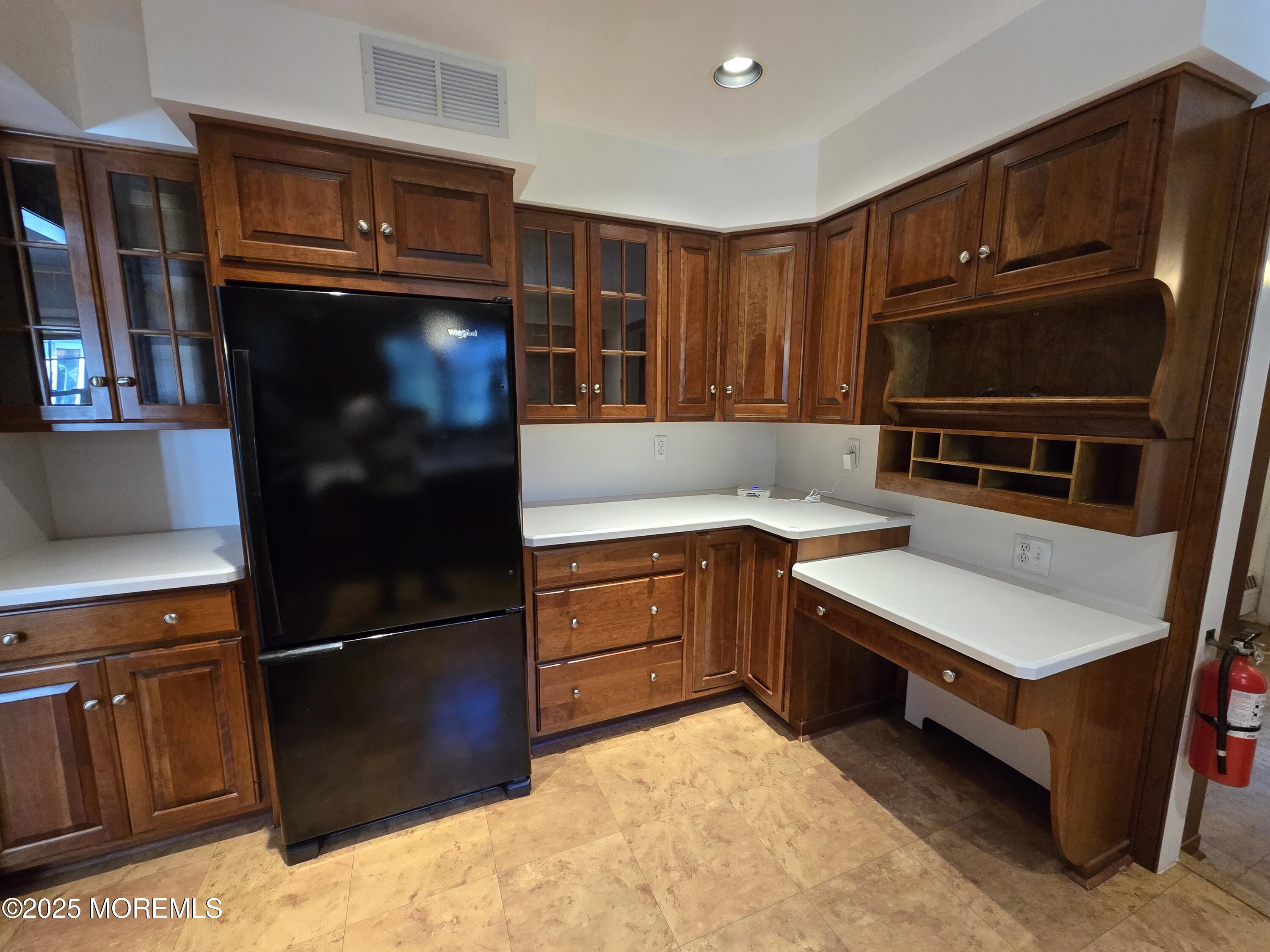 77 Dutch Lane Road Freehold, NJ 07728 - Photo 21 of 50 a kitchen with granite countertop stainless steel appliances and wooden cabinets