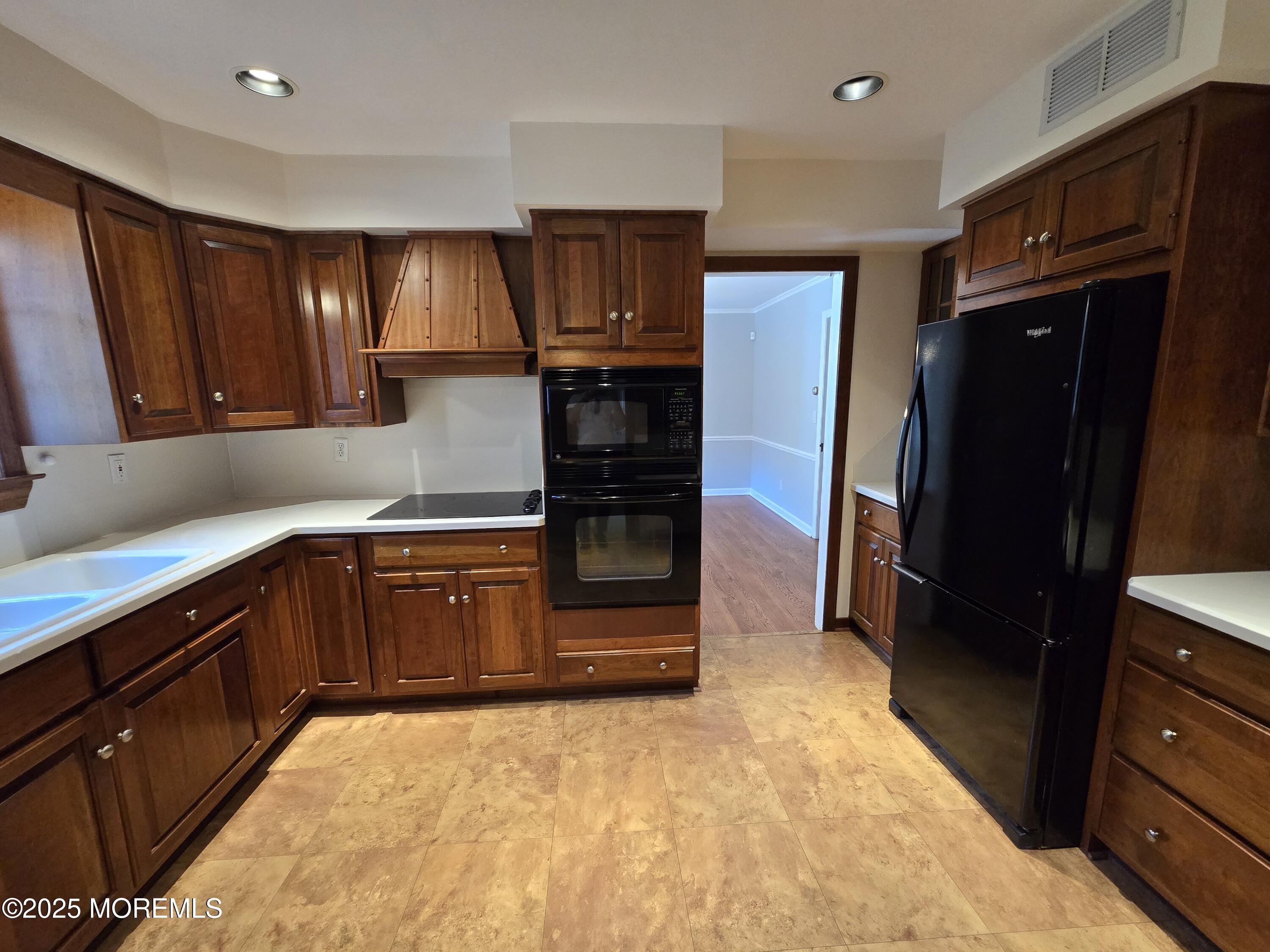 77 Dutch Lane Road Freehold, NJ 07728 - Photo 22 of 50 a kitchen with stainless steel appliances granite countertop a refrigerator and a sink