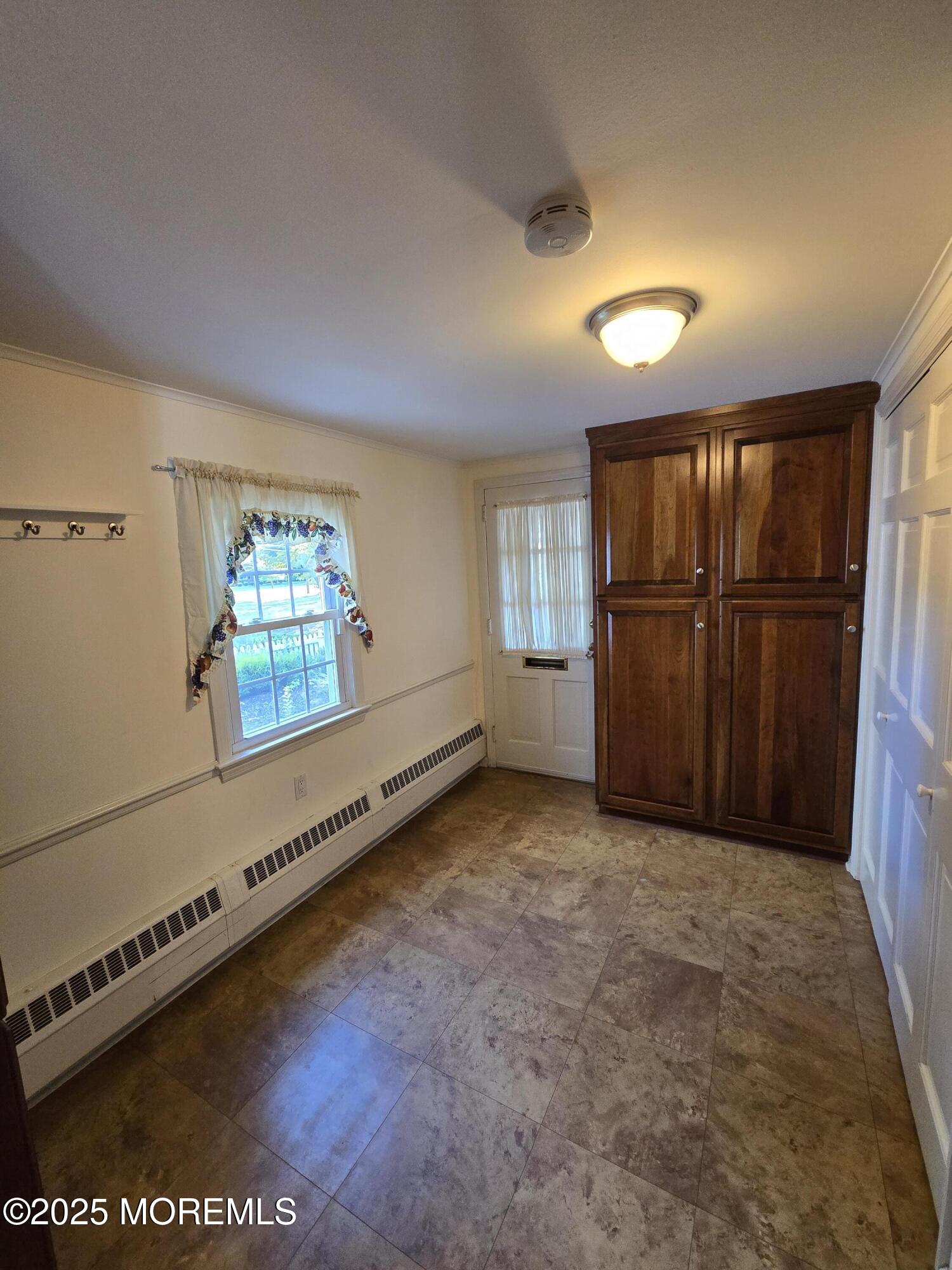 77 Dutch Lane Road Freehold, NJ 07728 - Photo 23 of 50 a view of an empty room with a window