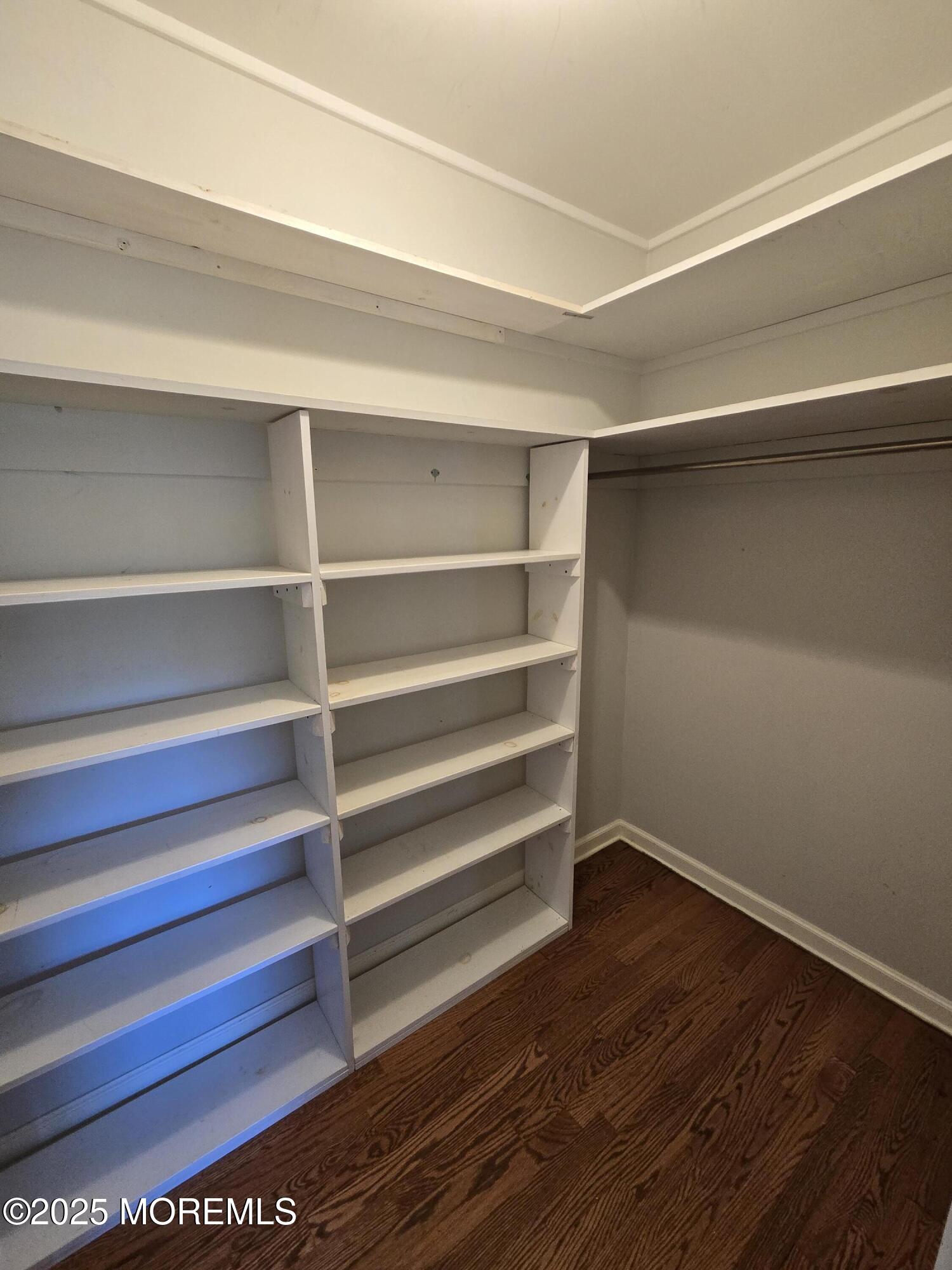 77 Dutch Lane Road Freehold, NJ 07728 - Photo 27 of 50 a view of walk in closet with empty racks