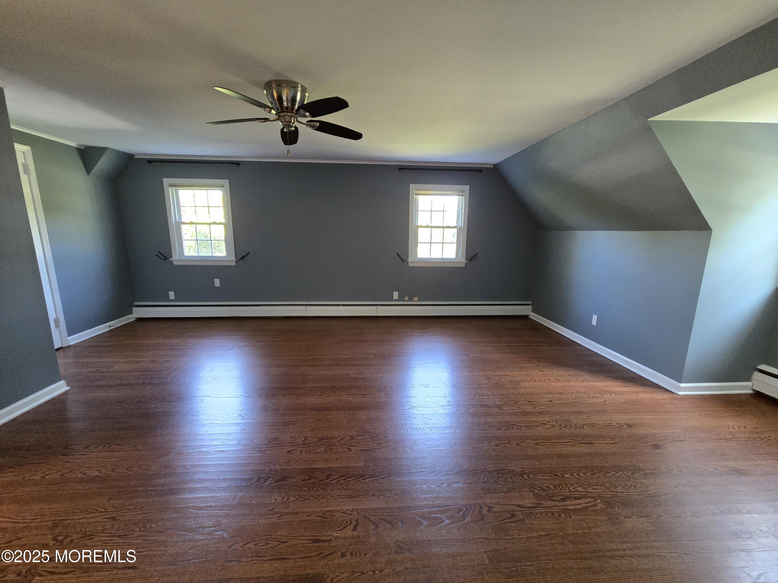 77 Dutch Lane Road Freehold, NJ 07728 - Photo 36 of 50 a view of an empty room with wooden floor and a window