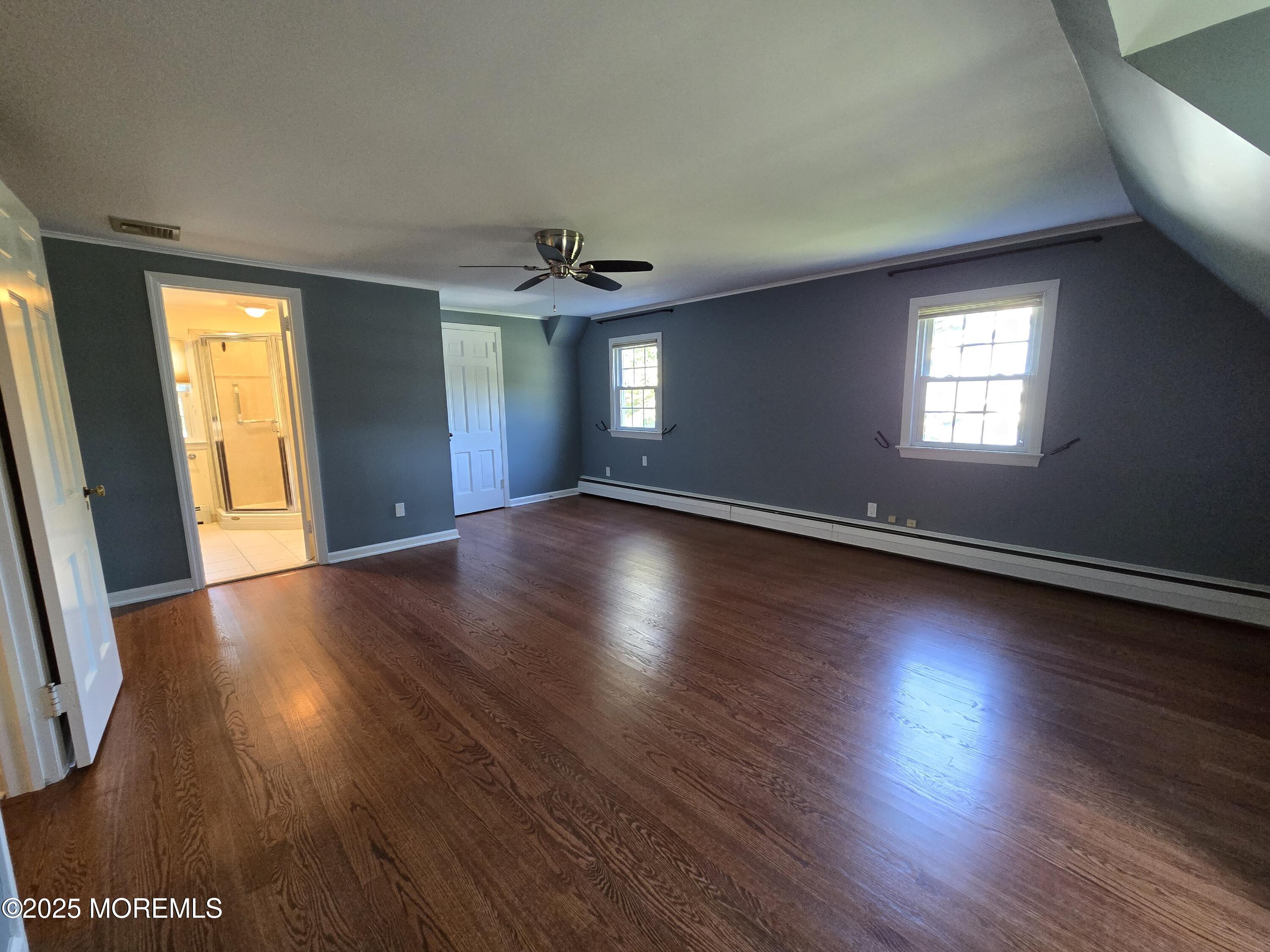 77 Dutch Lane Road Freehold, NJ 07728 - Photo 38 of 50 a view of an empty room with wooden floor and a window
