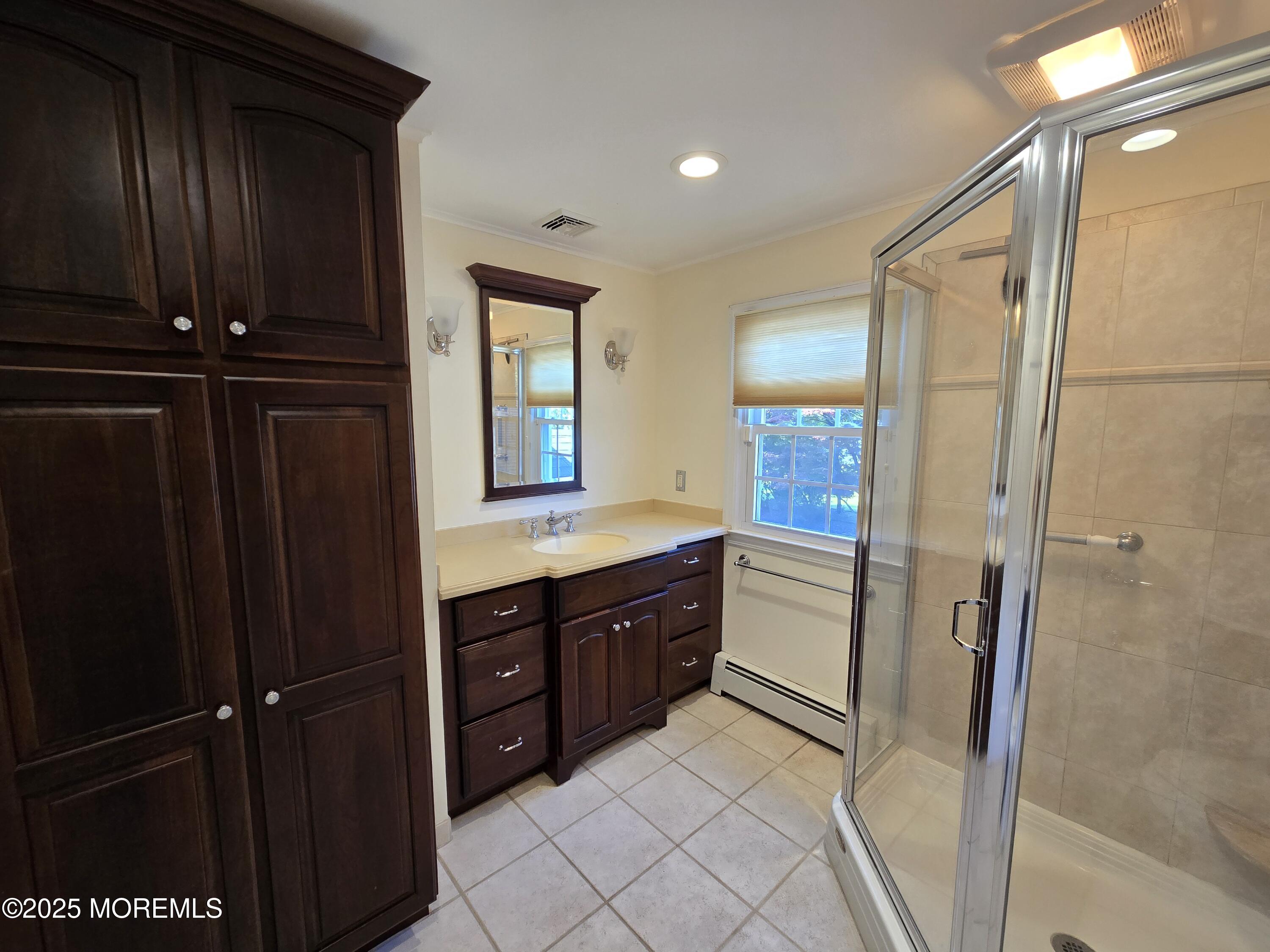 77 Dutch Lane Road Freehold, NJ 07728 - Photo 40 of 50 a kitchen with a refrigerator and a sink