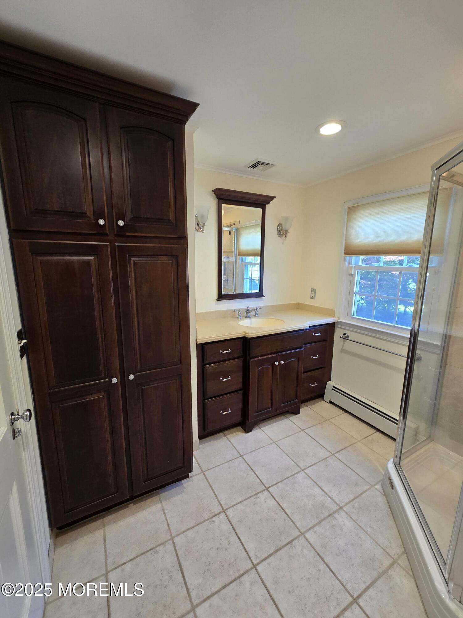 77 Dutch Lane Road Freehold, NJ 07728 - Photo 41 of 50 a room with a dresser and a mirror