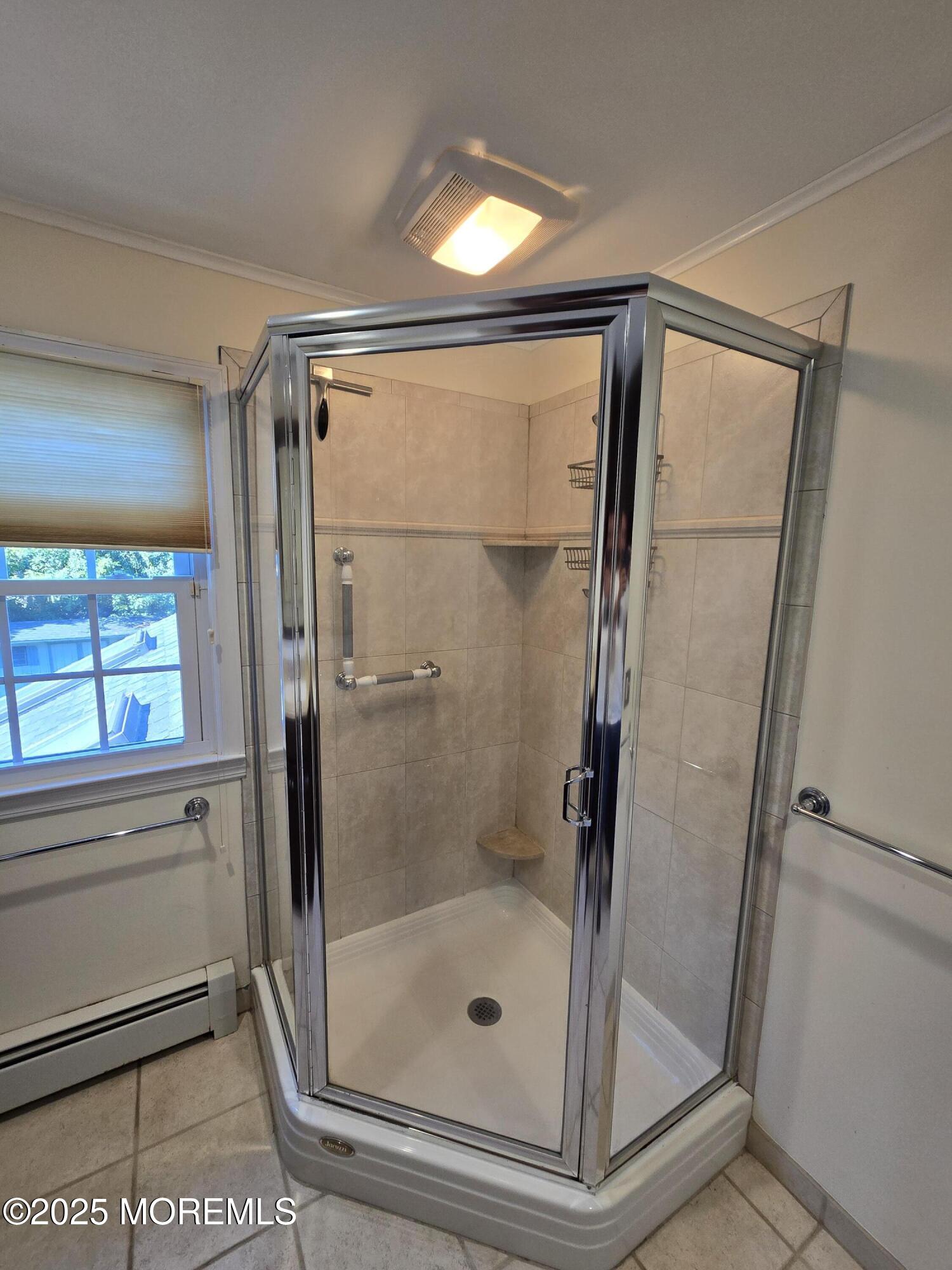 77 Dutch Lane Road Freehold, NJ 07728 - Photo 42 of 50 a bathroom with a glass shower door and a window