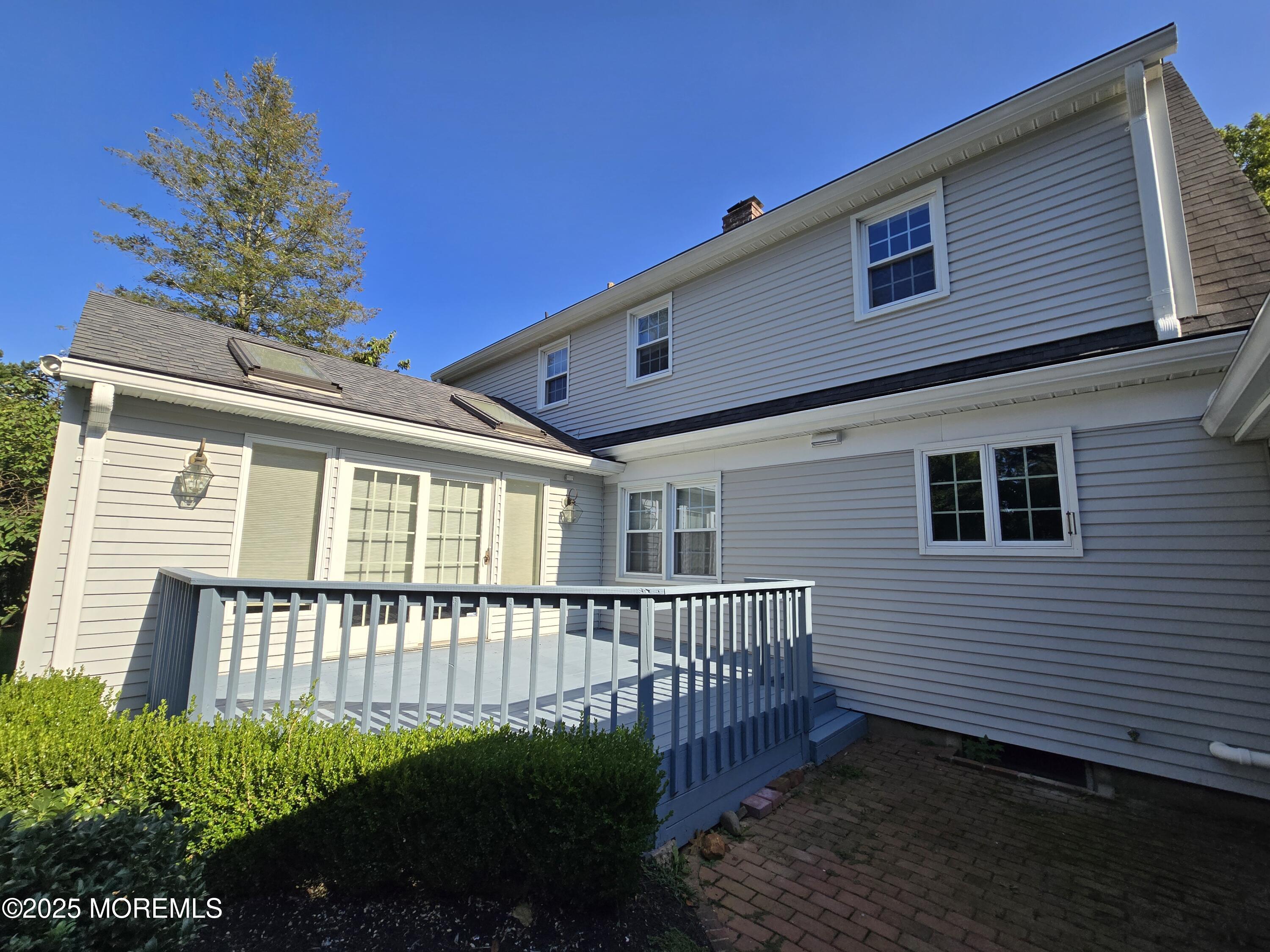 77 Dutch Lane Road Freehold, NJ 07728 - Photo 48 of 50 a front view of a house with a porch