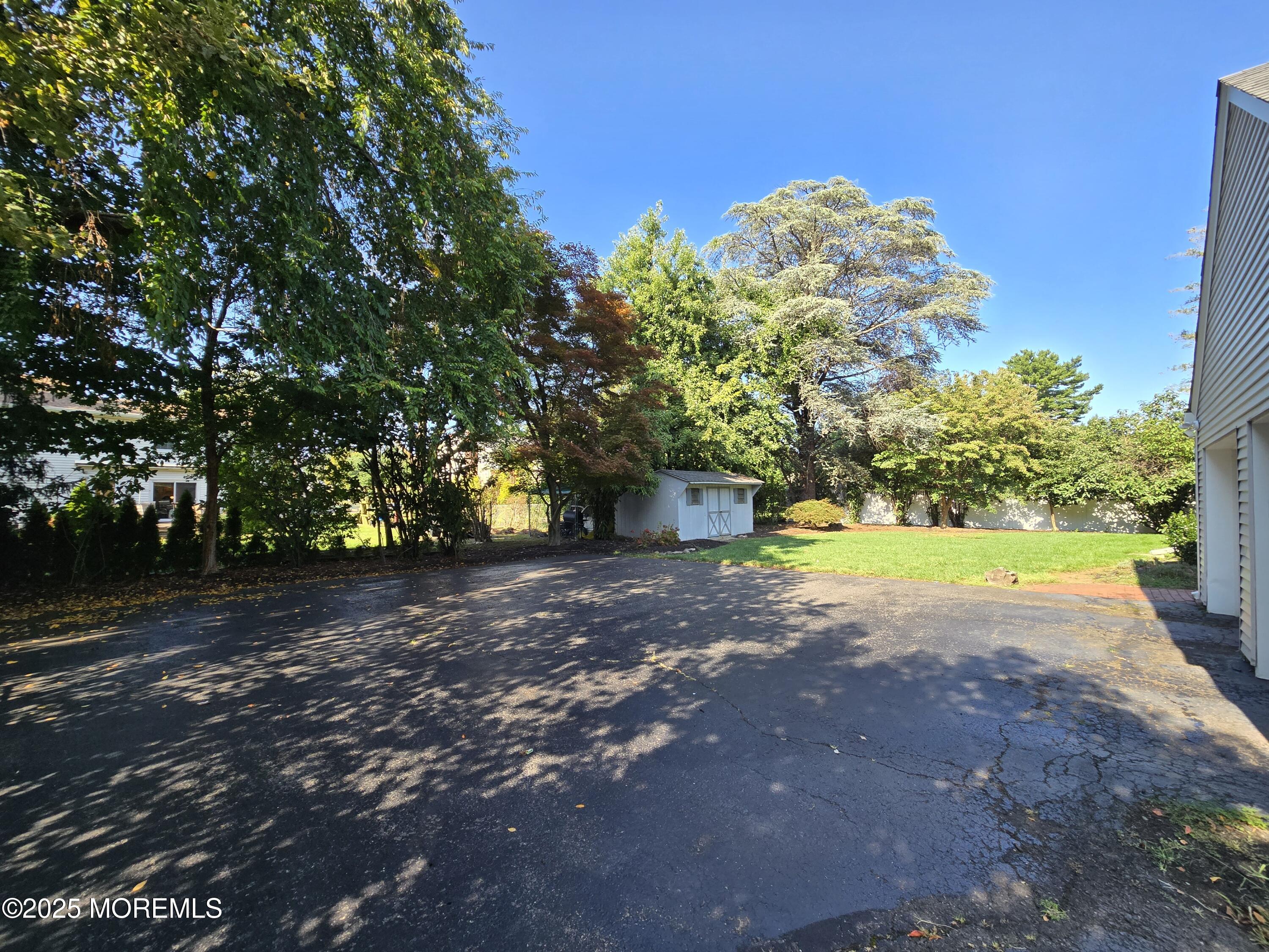 77 Dutch Lane Road Freehold, NJ 07728 - Photo 50 of 50 a view of a yard with plants and trees