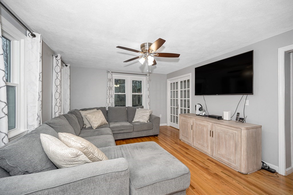 76 Maplewood Drive Townsend, MA 01469 - Photo 12 of 31 a living room with furniture and a flat screen tv