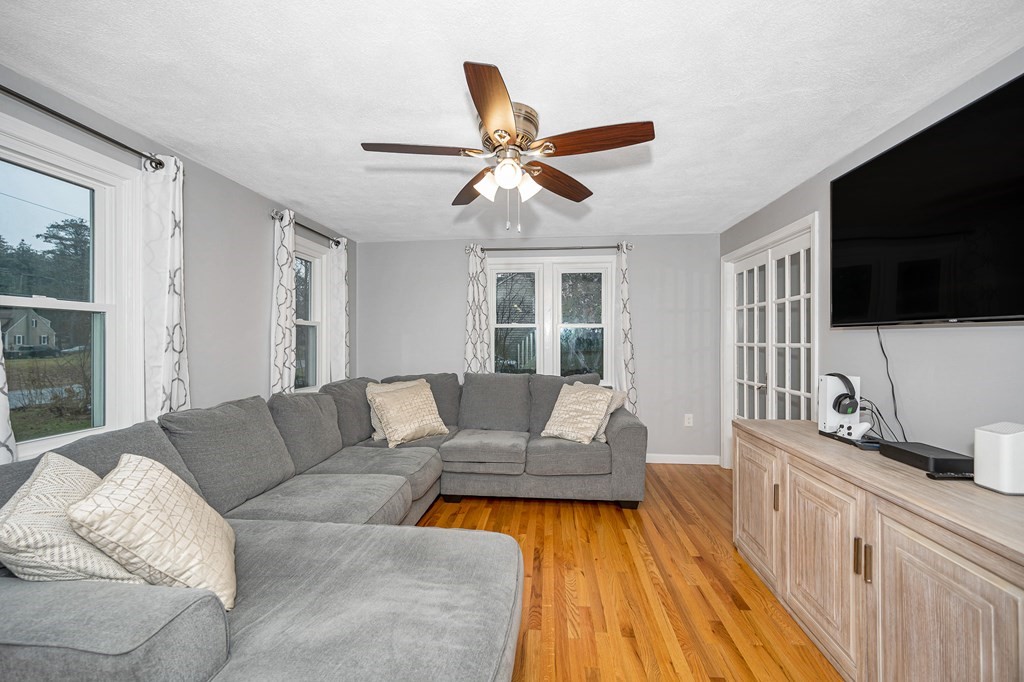 76 Maplewood Drive Townsend, MA 01469 - Photo 13 of 31 a living room with furniture and a flat screen tv