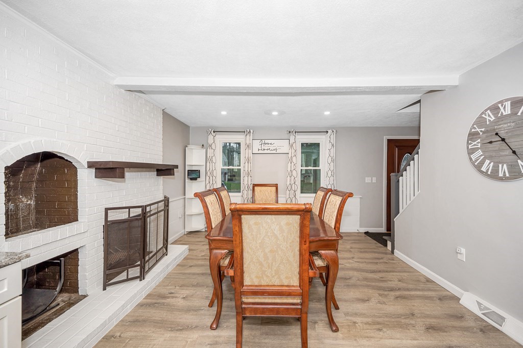 76 Maplewood Drive Townsend, MA 01469 - Photo 5 of 31 a view of a dining room with furniture a fireplace and wooden floor